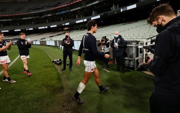 Jack Silvagni of the Blues leads the team from the field in memory of his grandfather Sergio after the 2021 AFL Round 18 match between the...