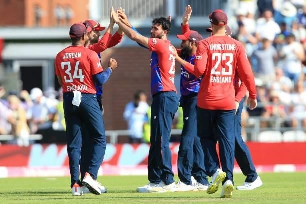England's Saqib Mahmood celebrates taking the wicket of Pakistan's Babar Azam during the second T20 international cricket match between England and...