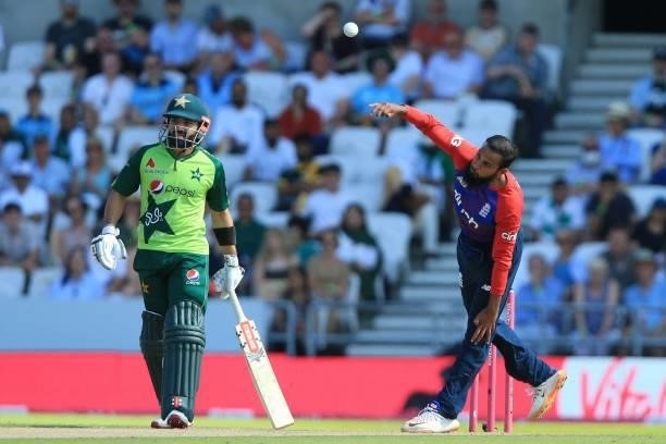 England's Adil Rashid bowls during the second T20 international cricket match between England and Pakistan at Headingley Cricket Ground in Leeds,...