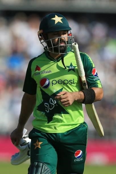 Pakistan's Mohammad Rizwan walks back to the pavilion after getting out during the second T20 international cricket match between England and...