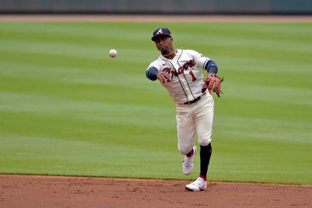 Ozzie Albies of the Atlanta Braves throws to first base in the second inning against the Tampa Bay Rays at Truist Park on July 18, 2021 in Atlanta,...