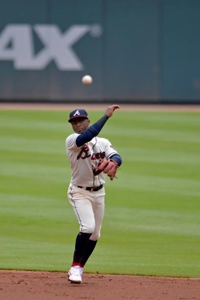 Ozzie Albies of the Atlanta Braves throws to first base in the second inning against the Tampa Bay Rays at Truist Park on July 18, 2021 in Atlanta,...