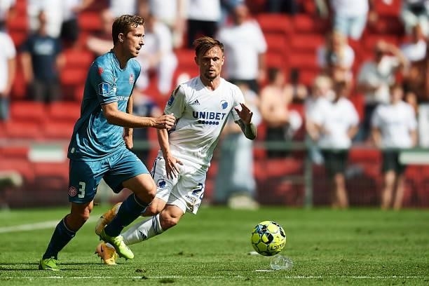 Jakob Ahlmann of AaB Aalborg and Peter Ankersen of FC Copenhagen compete for the ball during the Danish 3F Superliga match between FC Copenhagen and...
