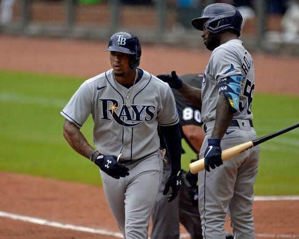 Wander Franco of the Tampa Bay Rays gets a pat on the back from Randy Arozarena after hitting a home run in the sixth inning against the Atlanta...