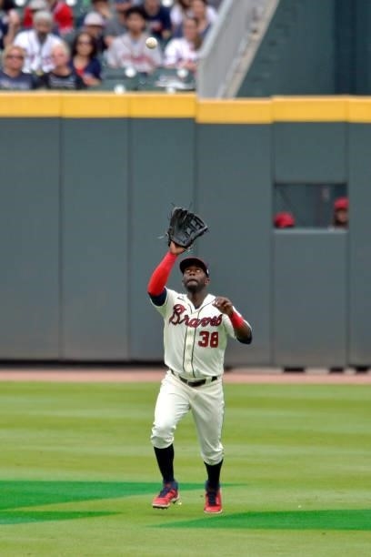 Guillermo Heredia of the Atlanta Braves field a fly ball in the fifth inning against the Tampa Bay Rays at Truist Park on July 18, 2021 in Atlanta,...