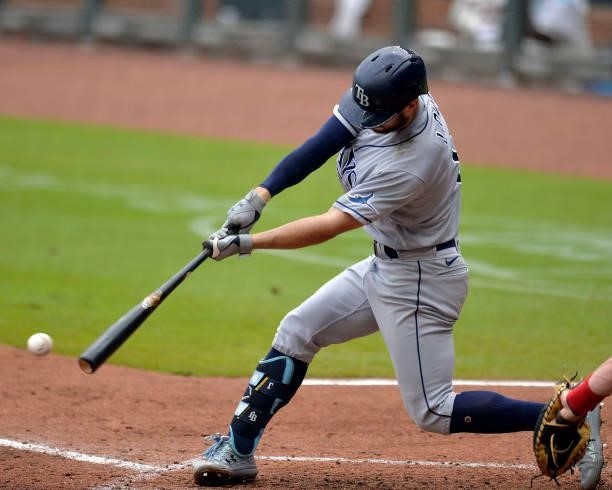 Brandon Lowe of the Tampa Bay Rays hits a single in the sixth inning against the Atlanta Braves at Truist Park on July 18, 2021 in Atlanta, Georgia.