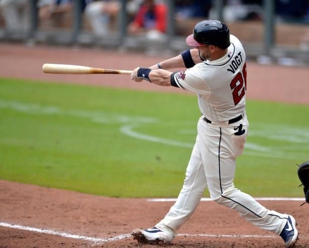 Stephen Vogt of the Atlanta Braves hits a single in the sixth inning against the Tampa Bay Rays at Truist Park on July 18, 2021 in Atlanta, Georgia.