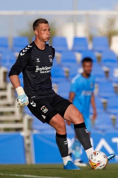 Simon Moore of Coventry City does passed during the pre-season friendly match between Sevilla CF and Coventry City at Pinatar Arena on July 17, 2021...