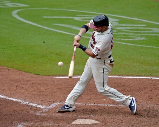 Stephen Vogt of the Atlanta Braves hits a single to score Freddie Freeman in the seventh inning against the Tampa Bay Rays at Truist Park on July 18,...