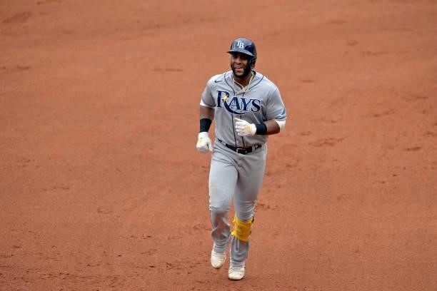 Yandy Diaz of the Tampa Bay Rays heads to third base on a two-run home run in the seventh inning against the Atlanta Braves at Truist Park on July...