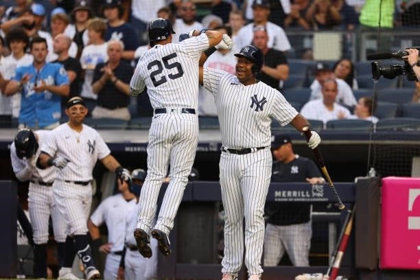 Gleyber Torres of the New York Yankees celebrates his home run with Chris Gittens against the Boston Red Sox during the second inning of a game at...