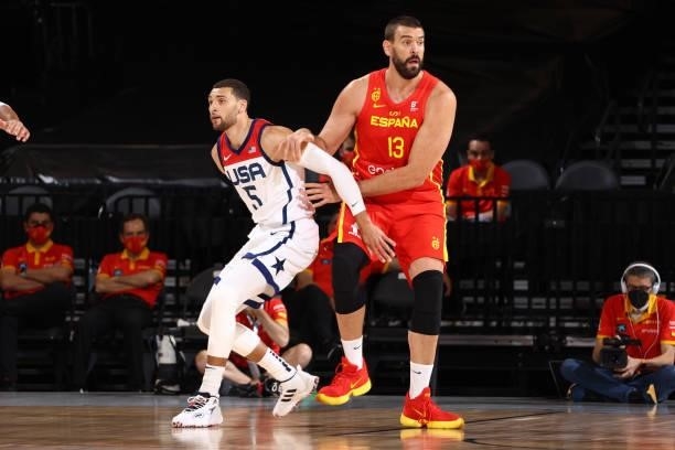 Zach LaVine of the USA Men's National Team plays defense on Marc Gasol of the Spain Men's National Team during the game on July 18, 2021 at Michelob...