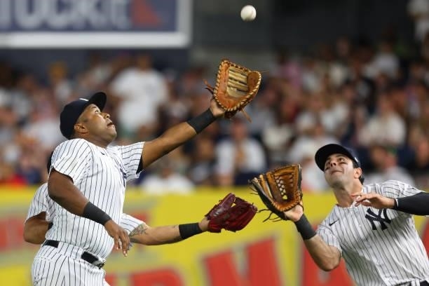 First baseman Chris Gittens of the New York Yankees makes the catch as Rougned Odor and Trey Amburgey converge on a ball off the bat of Bobby Dalbec...