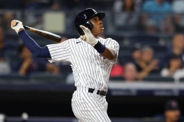 Greg Allen of the New York Yankees hits an RBI sacrifice fly against the Boston Red Sox in the fifth inning at Yankee Stadium on July 18, 2021 in New...