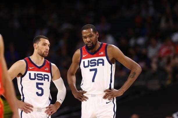 Zach LaVine of the USA Men's National Team and Kevin Durant of the USA Men's National Team look on before the game against the Spain Men's National...