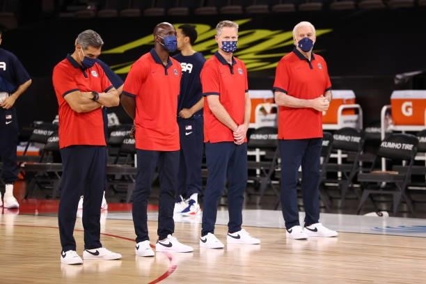 The USA Men's National Team coaching staff stand for the anthem before the game against the Spain Men's National Team on July 18, 2021 at Michelob...
