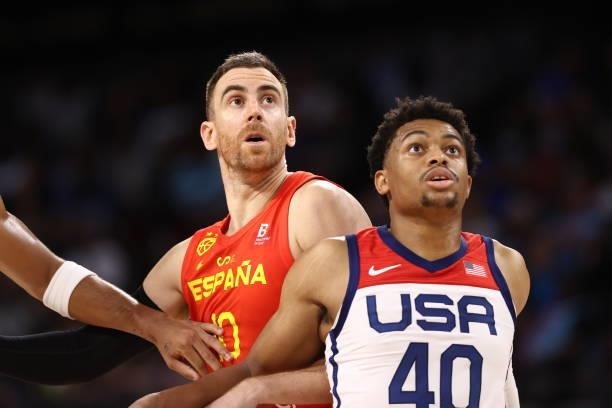 Victor Claver of the Spain Men's National Team and Keldon Johnson # of the USA Men's National Team fight for rebound during the game on July 18, 2021...