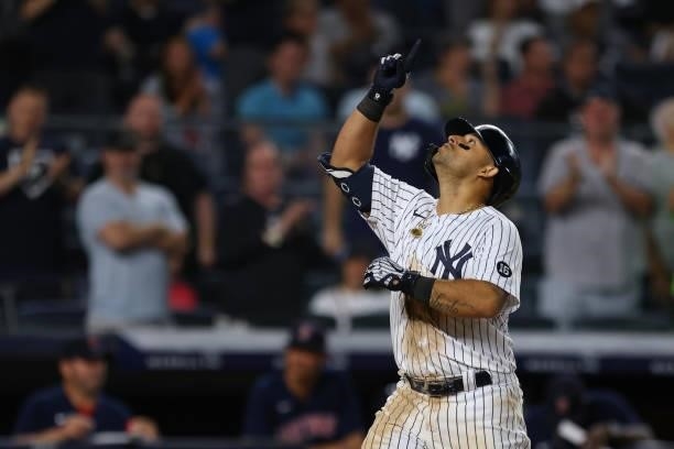 Rougned Odor of the New York Yankees gestures after hitting a home run against the Boston Red Sox in the seventh inning at Yankee Stadium on July 18,...