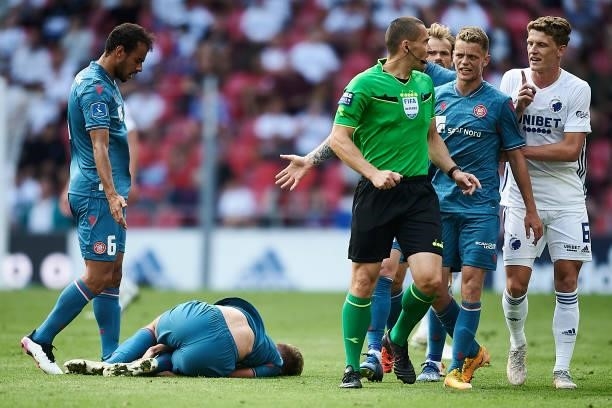 Mathias Ross of AaB Aalborg get an injury during the Danish 3F Superliga match between FC Copenhagen and AaB Aalborg at Parken Stadium on July 18,...