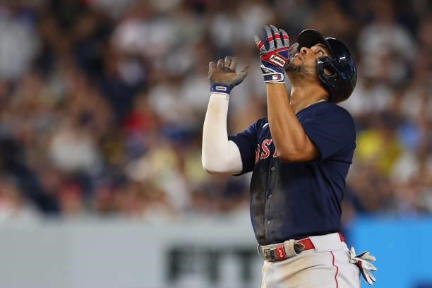 Xander Bogaerts of the Boston Red Sox reacts after hitting a double against the New York Yankees in the sixth inning at Yankee Stadium on July 18,...