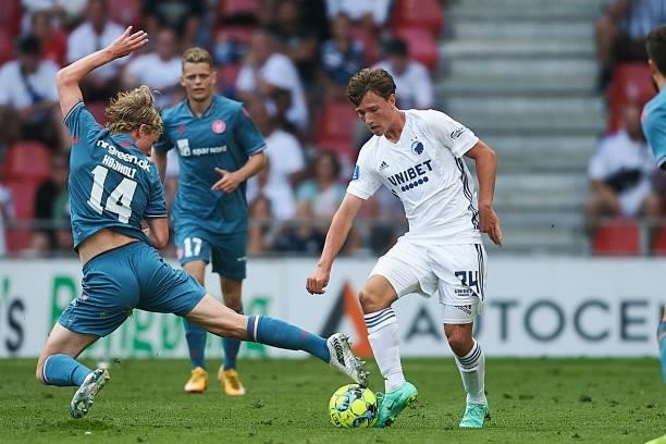 Malthe Hojholt of AaB Aalborg and William Boving of FC Copenhagen compete for the ball during the Danish 3F Superliga match between FC Copenhagen and...