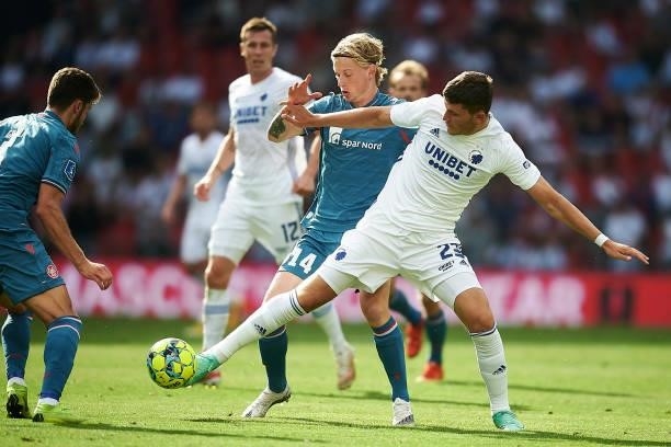 Malthe Hojholt of AaB Aalborg and Jonas Wind of FC Copenhagen compete for the ball during the Danish 3F Superliga match between FC Copenhagen and AaB...