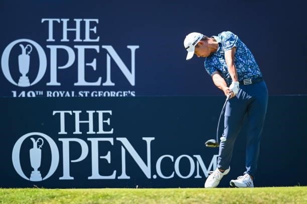 Collin Morikawa at impact as he plays his shot from the first tee during Day Four of the 149th The Open Championship at Royal St. Georges Golf Club...