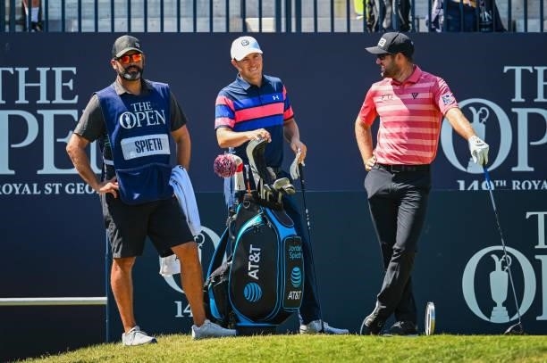 Jordan Spieth smiles on the first tee with his caddie Michael Greller and Corey Conners of Canada during Day Four of the 149th The Open Championship...