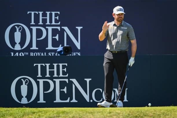 Louis Oosthuizen of South Africa smiles and waves to fans on the first hole tee during Day Four of the 149th The Open Championship at Royal St....