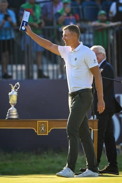 Low amateur Mattias Schmid of Germany smiles with the Silver Medal near the Claret Jug during Day Four of the 149th The Open Championship at Royal...