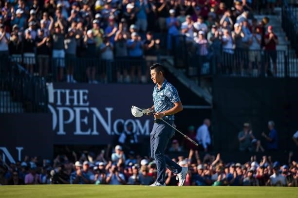 Collin Morikawa smiles and closes his eyes following his two stroke victory on the 18th hole green during Day Four of the 149th The Open Championship...