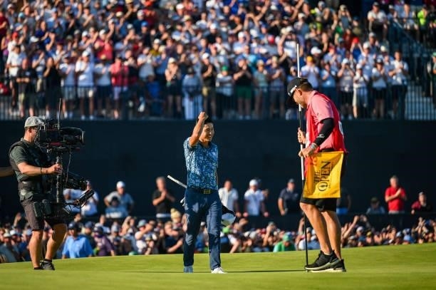 Collin Morikawa celebrates and smiles following his two stroke victory on the 18th hole green during Day Four of the 149th The Open Championship at...
