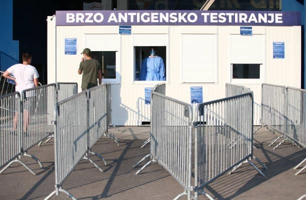 Fans are tested at a checkpoint for quick COVID-19 tests before entering the Maksimir Stadium prior to the UEFA Champions League Second Qualifying...