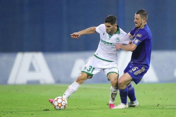 Ioannis Kousoulos of Omonoia and Arijan Ademio of Dinamo Zagreb in action during the UEFA Champions League Second Qualifying Round match between GNK...