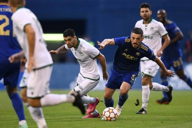 Arijan Ademi of Dinamo Zagreb and Ioannis Kousoulos of Omonoia battle for the ball during the UEFA Champions League Second Qualifying Round match...
