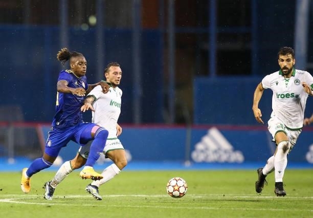 Francois Moubandje of Dinamo Zagreb and Eric Bautheac of Omonoia in action during the UEFA Champions League Second Qualifying Round match between GNK...