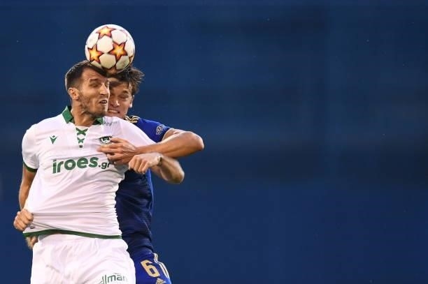 Marko Scepovic of Omonoia and Rasmus Lauritsen of Dinamo Zagreb in action during the UEFA Champions League Second Qualifying Round match between GNK...