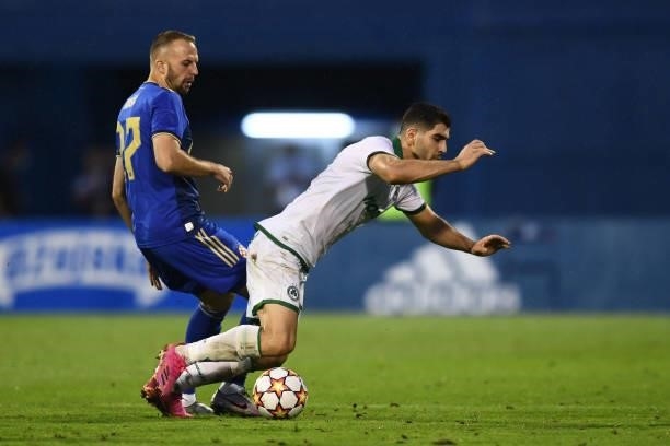 Josip Misic of Dinamo Zagreb and Ioannis Kousoulos of Omonoia in action during the UEFA Champions League Second Qualifying Round match between GNK...