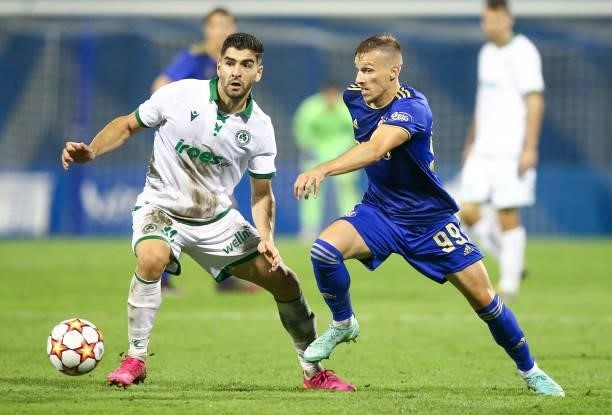 Ioannis Kousoulos of Omonoia and Mislav Orsic of Dinamo Zagreb in action during the UEFA Champions League Second Qualifying Round match between GNK...