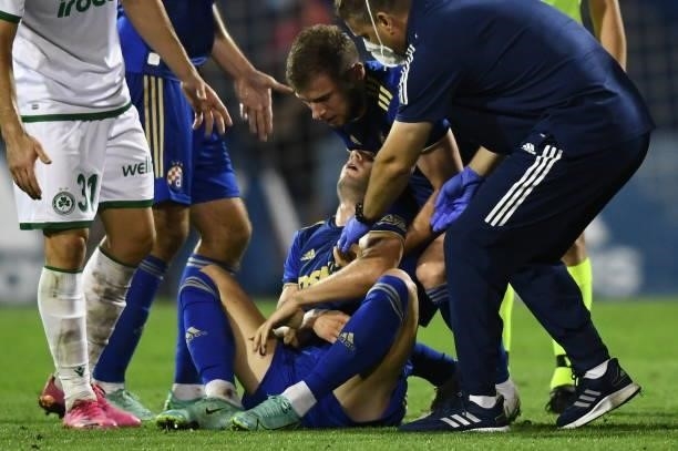 Luka Ivanusec of Dinamo Zagreb lies injured on the pitchduring the UEFA Champions League Second Qualifying Round match between GNK Dinamo Zagreb and...