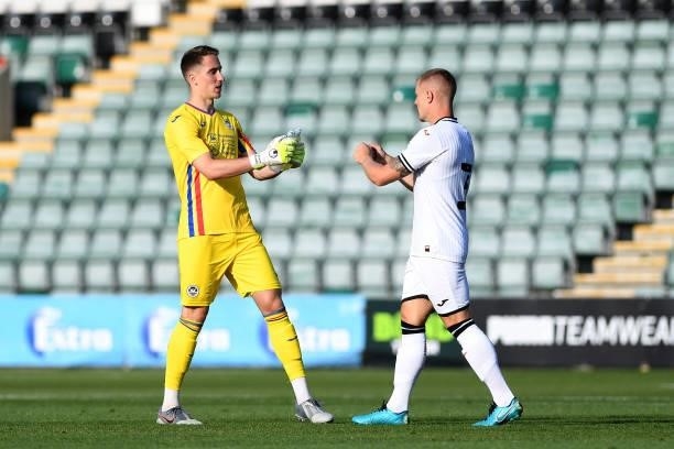 Steven Benda of Swansea City fist bumps Jake Bidwell of Swansea City during the Pre season friendly match between Plymouth Argyle and Swansea City at...