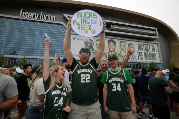 Milwaukee Bucks fans cheer outside of Fiserv Forum in the Deer District prior to Game Six of the 2021 NBA Finals on July 20, 2021 at Fiserv Forum in...