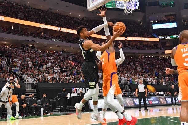 Giannis Antetokounmpo of the Milwaukee Bucks passes the ball against the Phoenix Suns during Game Six of the 2021 NBA Finals on July 20, 2021 at...
