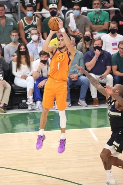 Devin Booker of the Phoenix Suns shoots a three point basket against the Milwaukee Bucks during Game Six of the 2021 NBA Finals on July 20, 2021 at...