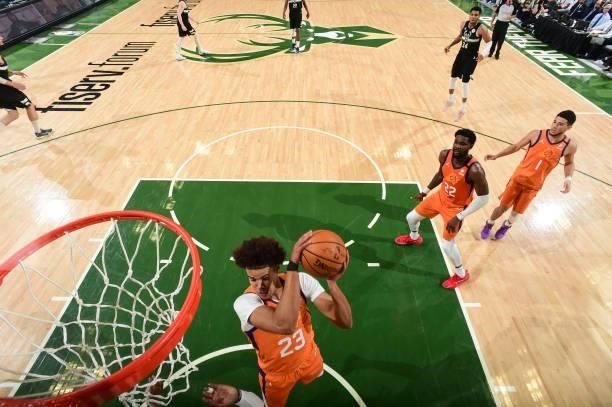 Cameron Johnson of the Phoenix Suns rebounds the ball during the game against the Milwaukee Bucks during Game Six of the 2021 NBA Finals on July 20,...
