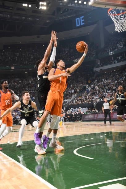 Devin Booker of the Phoenix Suns drives to the basket during the game against the Milwaukee Bucks during Game Six of the 2021 NBA Finals on July 20,...