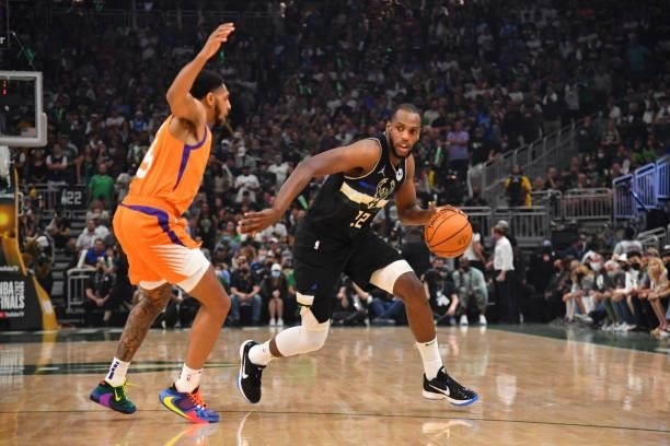Khris Middleton of the Milwaukee Bucks handles the ball against the Phoenix Suns during Game Six of the 2021 NBA Finals on July 20, 2021 at Fiserv...