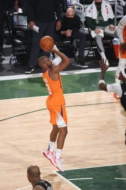 Chris Paul of the Phoenix Suns shoots a three point basket against the Milwaukee Bucks during Game Six of the 2021 NBA Finals on July 20, 2021 at the...