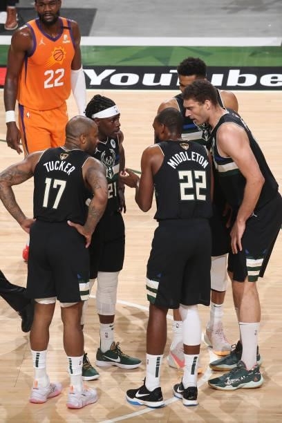 Khris Middleton, Jrue Holiday, P.J. Tucker, Brook Lopez and Giannis Antetokounmpo of the Milwaukee Bucks huddle up during Game Six of the 2021 NBA...