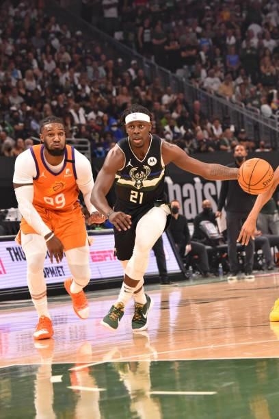 Jrue Holiday of the Milwaukee Bucks handles the ball against Jae Crowder of the Phoenix Suns during Game Six of the 2021 NBA Finals on July 20, 2021...